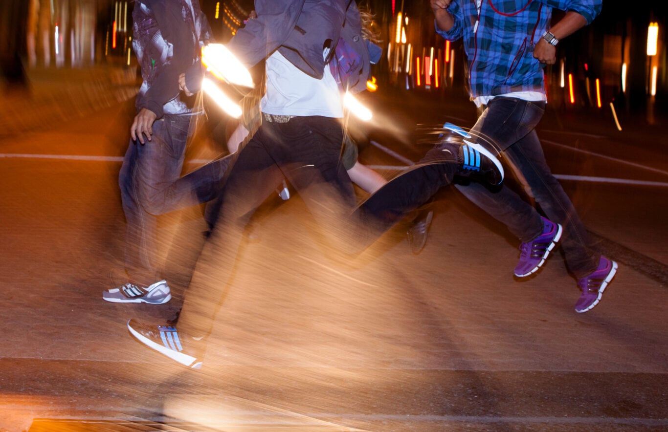 Youth crew running at night